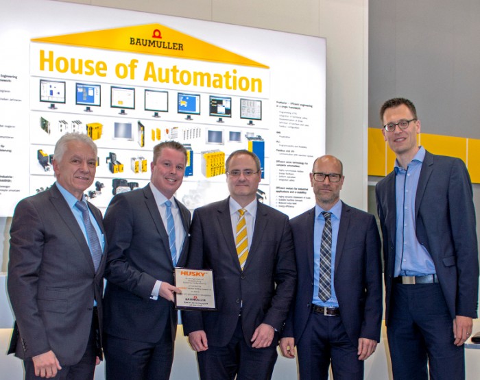 Supplier of the year Husky Baumüller 2016 During the presentation of the award “Supplier of the year 2015” at the Hannover Messe 2016, from left to right: Eugene Wojciechowski (Husky), Randy Auld (Husky), Andreas Baumüller (Baumüller), Stephan König (Husky), Roel Hoogveld (Husky)Photo by Baumüller Nürnberg GmbH