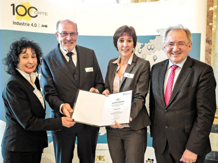 Happily and visibly proud the Rall family receives the award from Peter Hofelich. [From left to right: Hildegard Rall, Main Shareholder of Hainbuch, Gerhard Rall, CEO of Hainbuch, Sylvia Rall, Managing Director of Hainbuch, and Peter Hofelich, State Secretary in the Baden- Württemberg Ministry for finance and economy]Photo by HAINBUCH