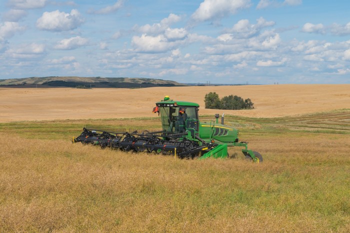 The John Deere 155 Self-Propelled Windrower offers fast cutting speeds and easy-to-maneuver controls for all types of conditions and field-terrain.Photo by John Deere International GmbH