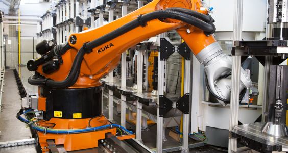 The Foundry variant of the KUKA KR FORTEC heavy-duty robot loads and unloads the changeover stations of the machining centers at MERZPhoto by KUKA Robotics Corp.