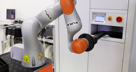 At ASM, the LBR iiwa interacts with the human operator without a safety fence – in both the mobile and stationary applications.Photo by KUKA Robotics Corp.
